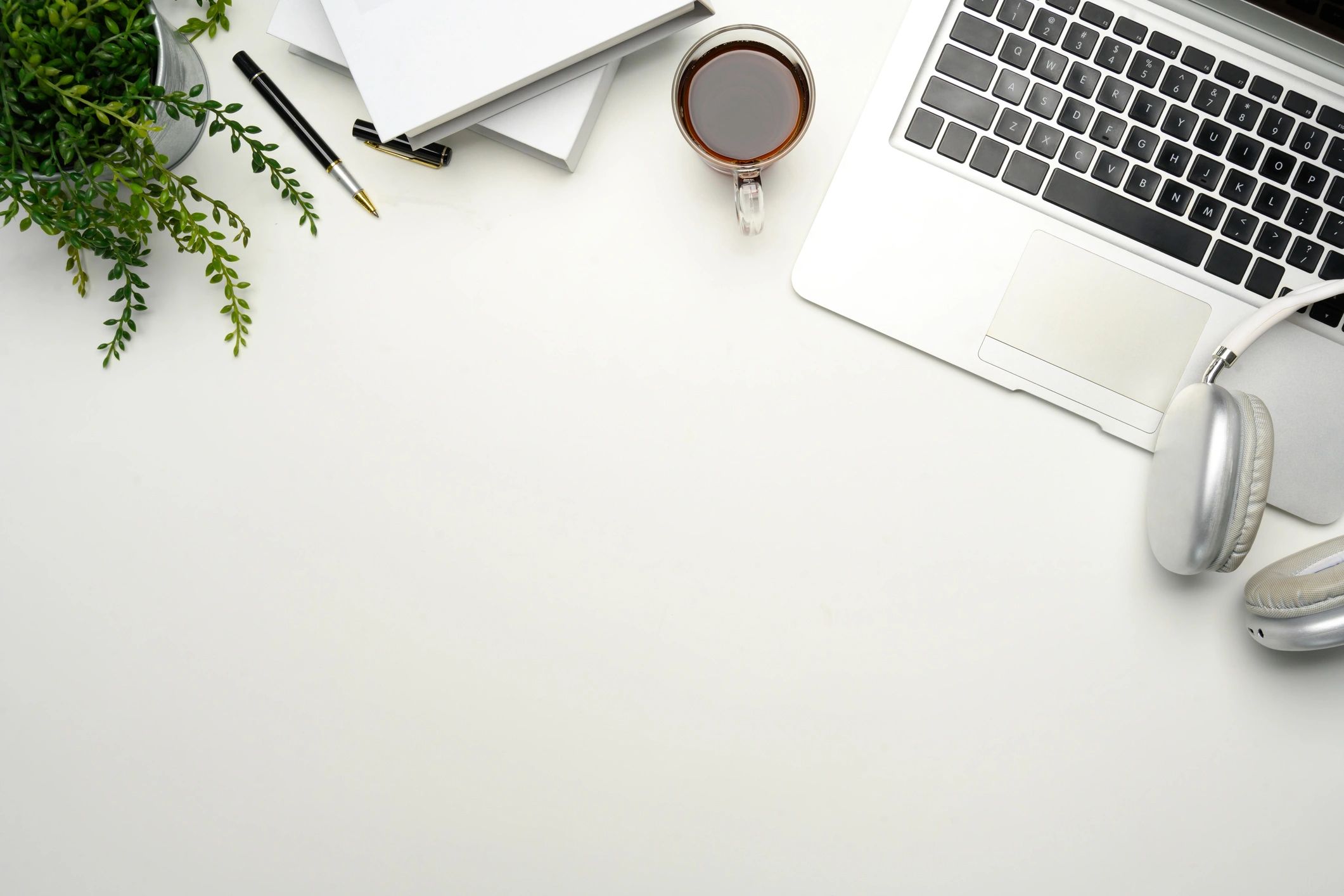 Minimalist workspace with laptop and coffee